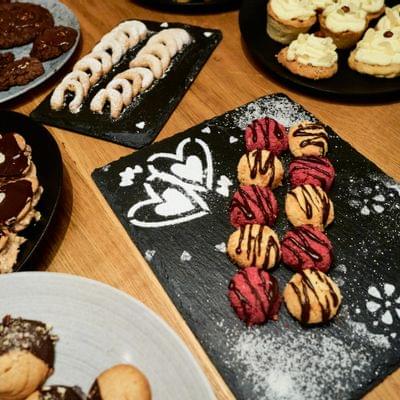 Assortment of festive Christmas cookies on decorative serving trays