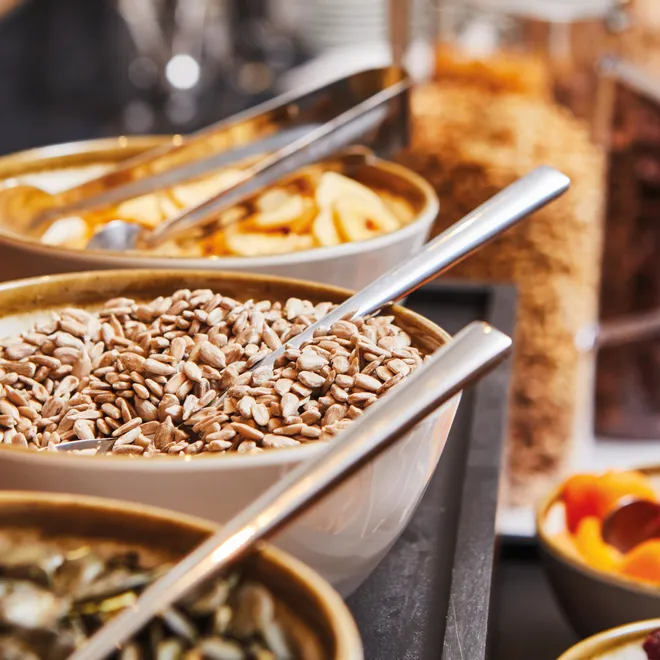 Healthy breakfast buffet with sunflower seeds, dried fruits and various cereals