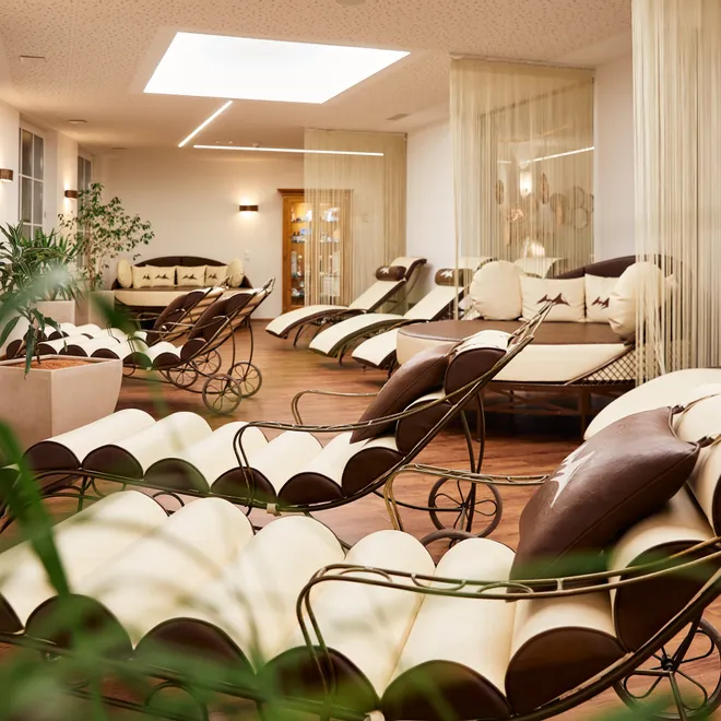 Elegant wellness lounge with comfortable relaxation chairs and warm lighting